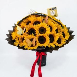 ramo gigante de 50 girasoles con empaque negro cinta personalizada corona mariposas y chocolates ferrero rocher cali