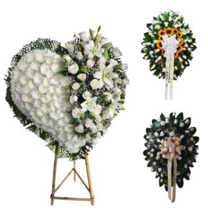 set funebre de 3 coronas grandes con corazon tapizado rosas blancas lirios y girasoles cali